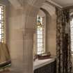 Interior. Staircase, view of stained glass on landing