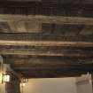 Interior, detail of painted wooden ceiling, upper ground floor, NE house.
