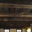 Interior, detail of painted wooden ceiling, upper ground floor, NE house.