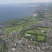 General oblique aerial view of Musselburgh centred on Musselburgh Old Golf Course, taken from the SW.