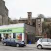 General view of derelict red brick former bakery at 6-8 East Princes Street, Rothesay, Bute, from NW