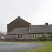 General view of the church hall with the rear gable of the church beyond, taken from the north west.