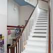 VIew of curved balcony stair to south east side of church entrance hall.