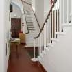 General view showing arrangement of balcony stairs within entrance hallway.