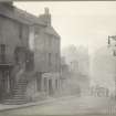 Photograph showing Candlemaker Row, Edinburgh.
Titled: 'Candlemaker Row - West side, looking north, showing old Houses on Churchyard wall. (now demolished.). 1890. G G.Mitchell'.
Edinburgh Photographic Society Survey of Edinburgh and District, Ward XIV George Square