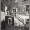 Photograph showing High Riggs, Edinburgh with inhabitants outside. 
Titled: 'High Riggs. Old houses, now demolished. 1904. A H Baird'. 
Edinburgh Photographic Society Survey of Edinburgh and District, Ward XIV George Square