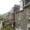 View of rear elevations from S showing 'Colonies style' entrances to 4-19 Victoria Place, Marine Road, Port Bannatyne, Bute