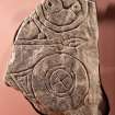 View of Pictish symbol stone fragment (flash), including scale
