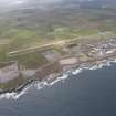 General oblique view of Dounreay Nuclear Power Development Establishment, and the disused airfield, looking to the SE.
