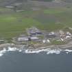 Oblique aerial view of Dounreay Nuclear Development Establishment, centred on the SW site, looking SE.