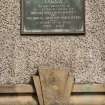 Detail of plaque reading 'S.V.G.V.A The Bute branches of the Scottish branch of The British Red Cross Society and The Royal Artillery Association in memory of the fallen 1939-1945' at 1-5 Sheriff's Croft, Barone Road, Rothesay, Bute