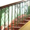 Interior. Detail of metal framework on bannister, first floor landing.