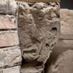 Detail of medieval stone set into font structure.