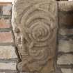 Detail of medieval stone set into font structure.