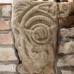 Detail of medieval stone set into font structure.