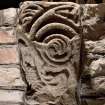 Detail of medieval stone set into font structure.