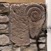 Detail of medieval stone set into font structure.