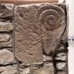 Detail of medieval stone set into font structure.