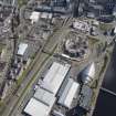 General oblique aerial view of the River Clyde and the Scottish Exhibition and Conference Centre showing construction of the Hyrdo, looking SE.