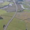 General oblique aerial view along the M9 with Craigforth House in the distance, looking S.