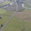 General oblique aerial view along the M9 with Craigforth House in the distance, looking SSE.