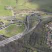 Oblique aerial view of the junction of the A898 and the Great Western Road, looking NNE.