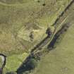 Oblique aerial view of Ewes Castle, taken from the WSW.