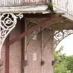 Detail of cast iron brackets and stone corbels on balcony.