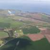 General oblique aerial view of Dunbar, Oxwellmains Cement Works, Barns Ness Lighthouse and Thurston Manor, looking NNE.
