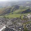 General oblique aerial view of Holyrood Park, Arthurs Seat and Palace of Holyroodhouse, looking S.