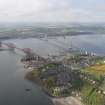 General oblique aerial view of Forth Rail Bridge, Forth Road Bridge, North Queensferry and construction of Queensferry Crossing, looking SW.