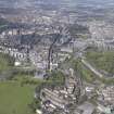 General oblique aerial view of Holyrood Park, Calton Hill, Royal Mile, Old Town and New Town, looking W.