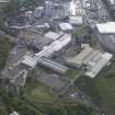 Oblique aerial view of Balbirnie Paper Mill, Glenrothes, Auchmuty Mill, Rothes Mills Paper Factory, looking E.