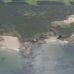 Oblique aerial view of the coastline at Covesea, looking SSE.