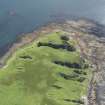 Oblique aerial view of Am Fraoch Eilean and Claig Castle, looking W.