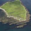 Oblique aerial view of Am Fraoch Eilean and Claig Castle, looking N.