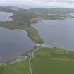 General oblique aerial view of Ring of Stenness, Ring of Brodgar and Bridge of Brodgar, looking NW.
