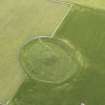 Oblique aerial view of Maeshowe Chambered Cairn, looking SSW.
