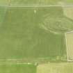 Oblique aerial view of Maeshowe Chambered Cairn, looking NNE.