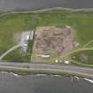 Oblique aerial view of the excavations at Ness of Brodgar, looking SW.