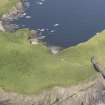 Oblique aerial view centred on the broch at Lamb Head, Stronsay, looking NE.