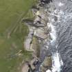 Oblique aerial view of the rocky shore at Northside, looking WSW.

