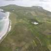 General oblique aerial view centred on North Ronaldsay golf course, looking S.