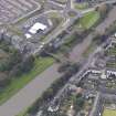 Oblique aerial view of Musselburgh Old Bridge, looking to the SSW.