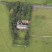 General oblique aerial view of Monkton House with adjacent stable, looking to the WNW.