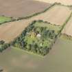 General oblique aerial view of Pilmuir House with adjacent dovecot, looking to the NW.