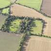 General oblique aerial view of Pilmuir House with adjacent dovecot, looking to the WSW.