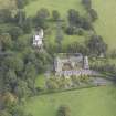 General oblique aerial view of Keith Marischal Country House with adjacent stables, looking to the NE.