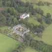 General oblique aerial view of Keith Marischal Country House with adjacent stables, looking to the N.