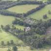 General oblique aerial view of Keith Marischal Country House with adjacent stables, looking to the S.